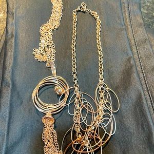 Two very gold costume jewelry necklaces